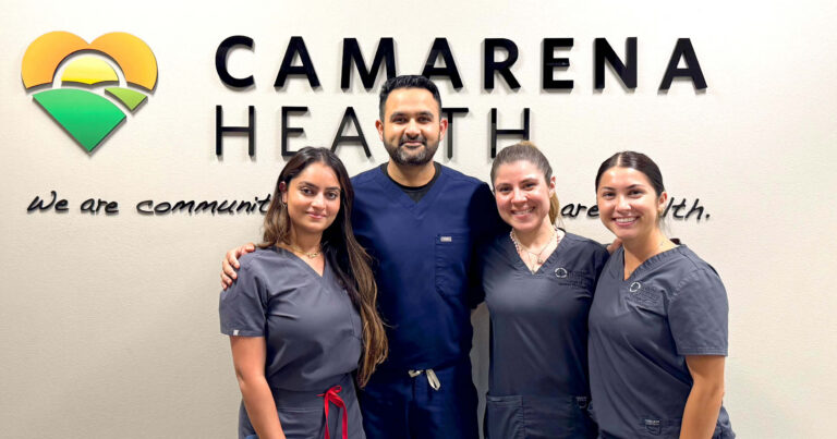 On wall behind director and students, signage reads: Camarena Health
